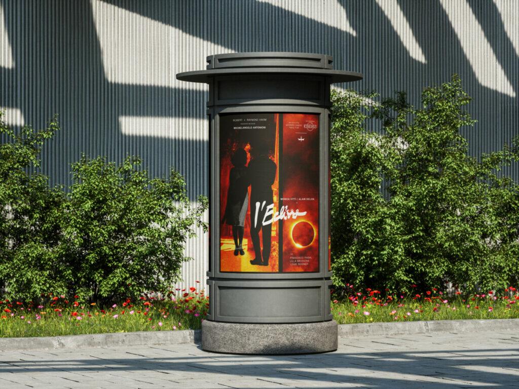Publicité d'un arrêt de bus présentant l'affiche du film "L'Eclisse", entourée de verdure et de fleurs.

